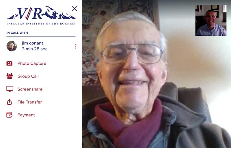An elderly gentleman uses a telemedicine link to meet with his doctor.